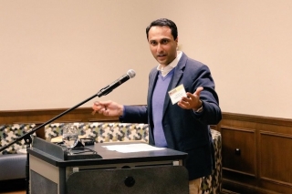 Eboo Patel speaking at a podium