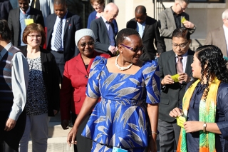 Beauty Maenzanise and CCTEF members gather on the steps of the GBHEM offices.