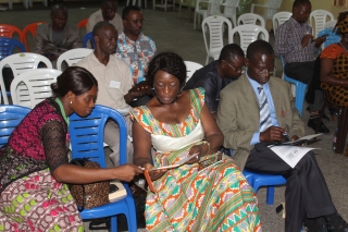 Rev. Dr. Yatta Young, Dean of the Bishop Innis Graduate School of Theology at UMU in Monrovia (center) interacts with students during the recent e-reader training there on June 15.