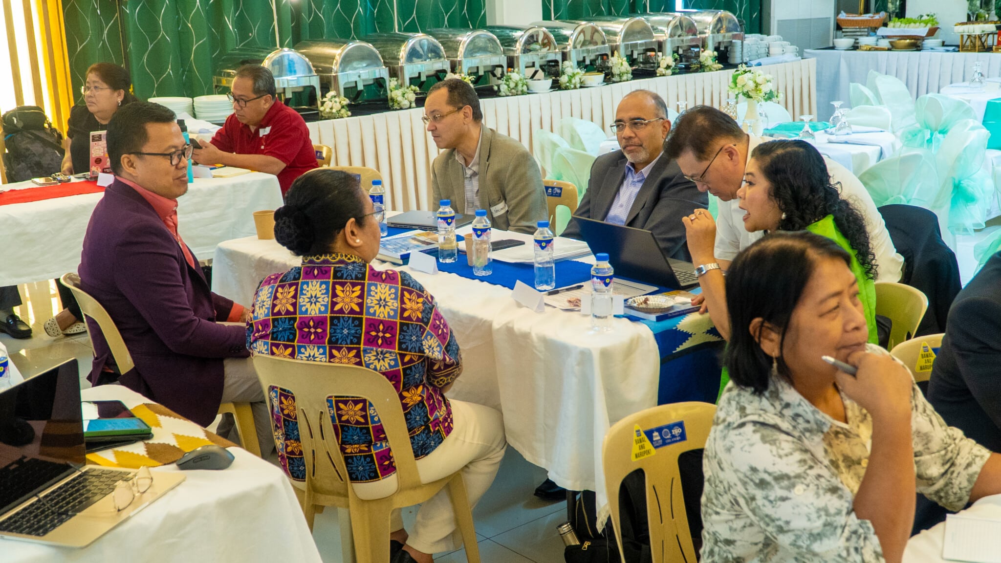 Small-group discussions at the Philppine roundtable meeting with Roland Fernandes (in grey jacket). (Photo: John Leo Sarmiento, JL Visuals)