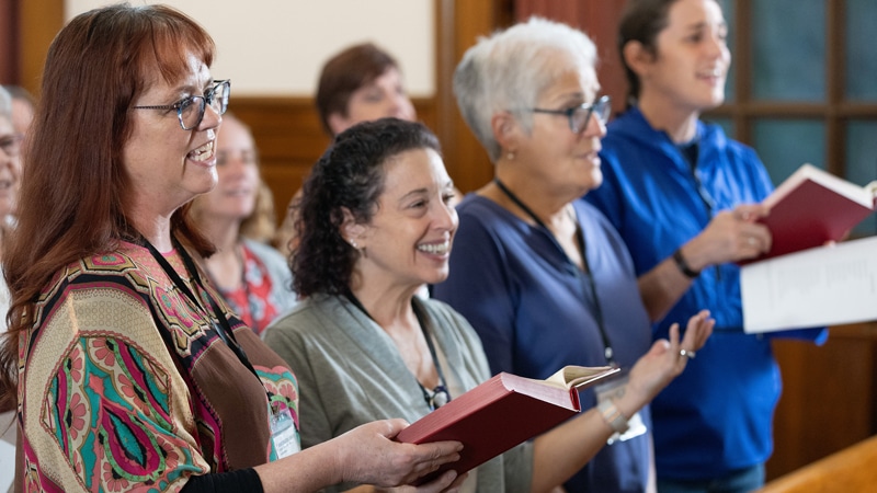 5-7-26-Clergy-Roles Participants in the 2025 United Methodist Church Deacons Gathering sing during opening worship at the Upper Room Chapel in Nashville, Tenn. From left are Shannon Howard, Tina Marie Rees, the Rev. Sherry Brady and Candace Brady. Photo by Mike DuBose, UM News.